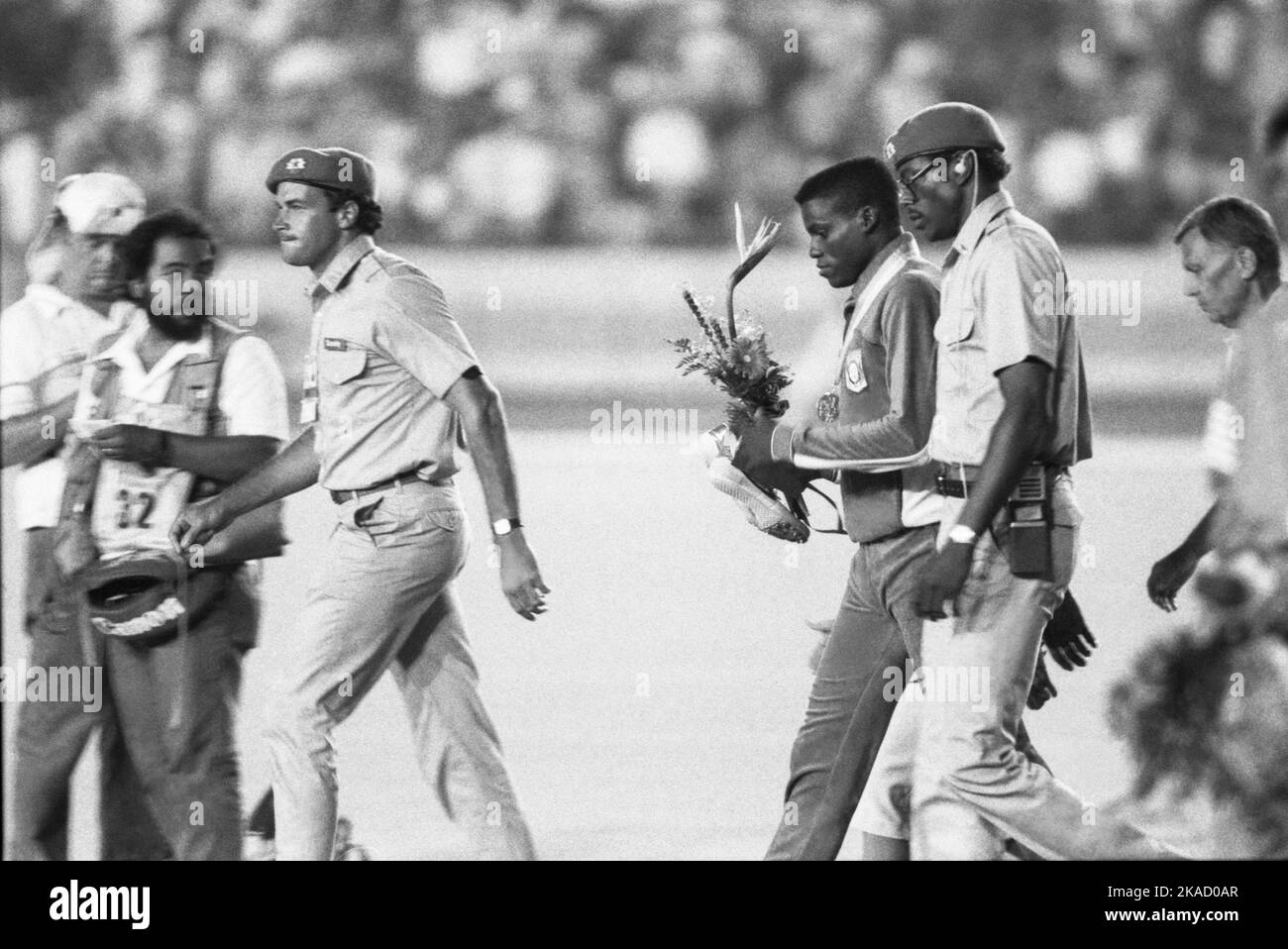 OLYMPIC SUMMER GAMES IN LOS ANGELES USA 1984 CARL LEWIS USA on way to dopning control after his win at 100 m Stock Photo