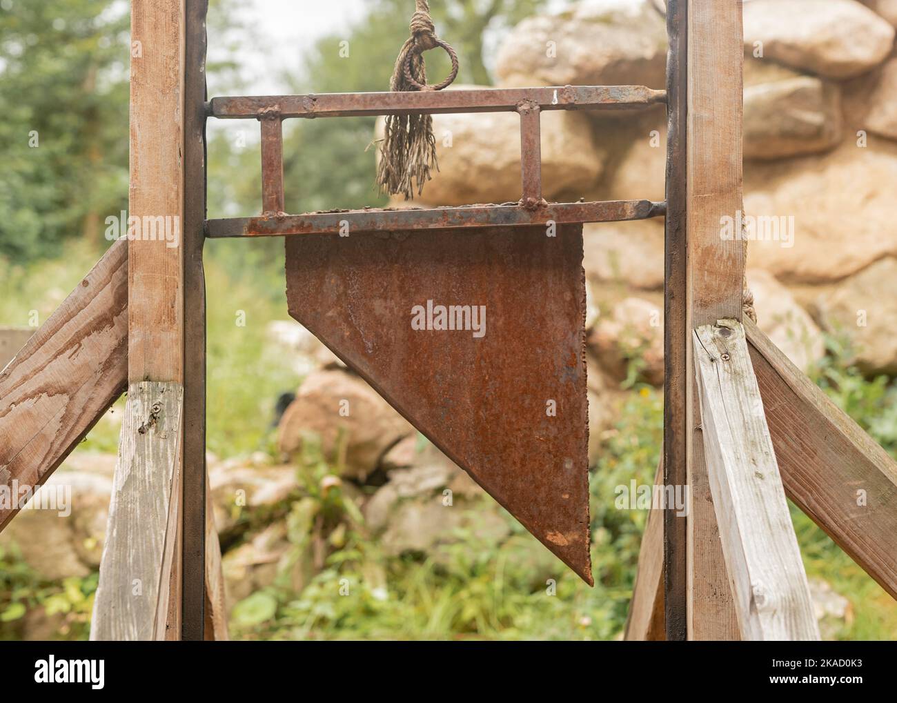 Guillotine, medieval decapitated equipment for punishment, blade closeup. Stock Photo