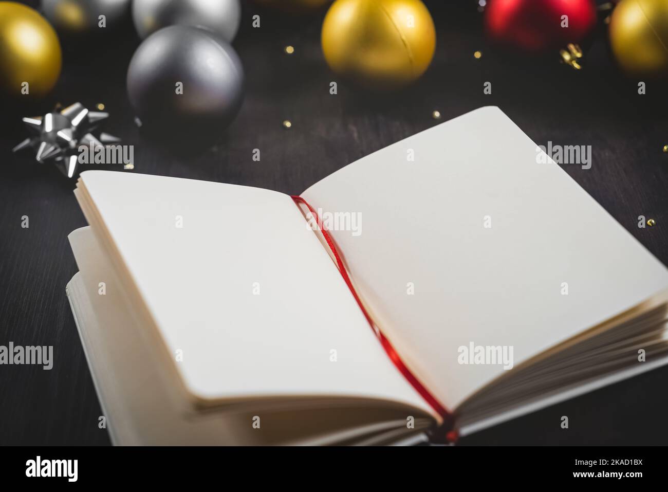 New Year concept and background with Christmas ornaments and notebook. Stock Photo