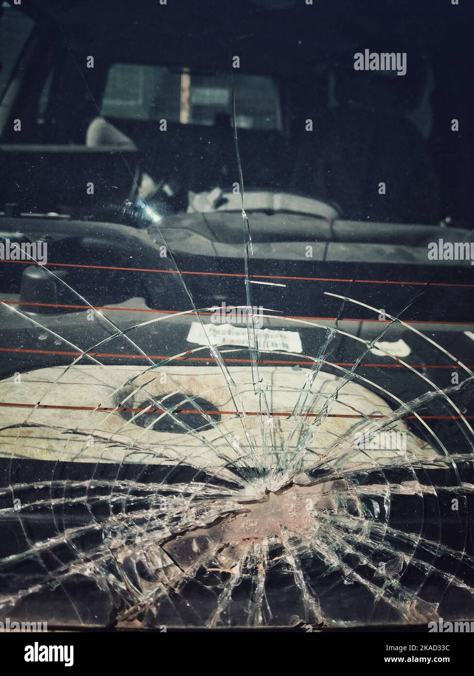 Broken car windshield. Damage to the glass due to road accident Stock