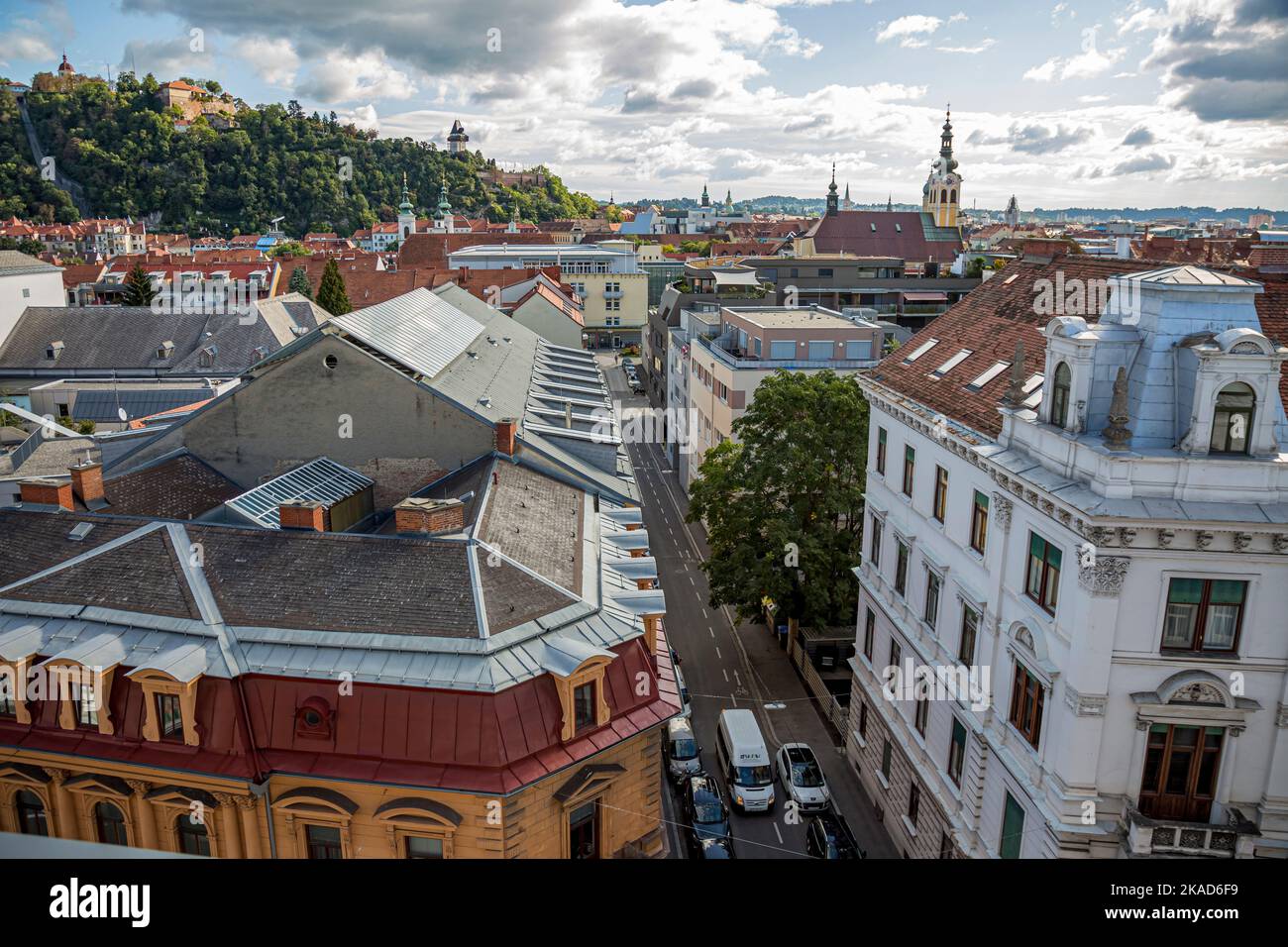 View of the city of Graz from above, Austria.Architecture details -red tiles on the roofs of the old town. Stock Photo