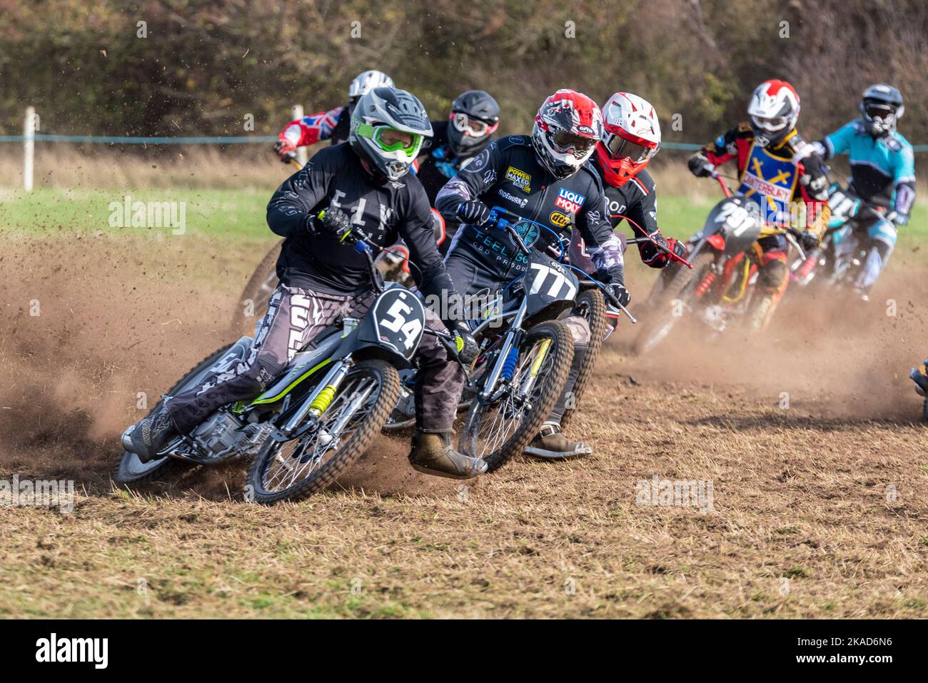 GT140 solo motorbike riders racing in grasstrack motorcycle race. Donut
