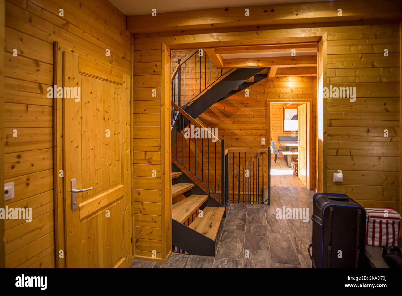 Traditional wooden interior with table and fixtures - mountain resort. Stock Photo
