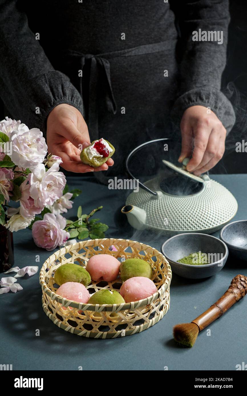 Japanese dessert mochi with matcha green tea powder and cherry