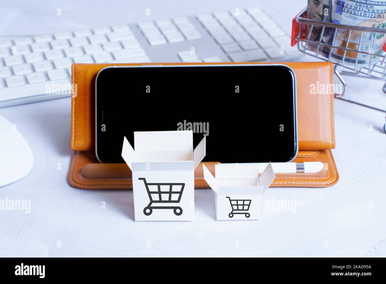Open miniature delivery boxes placed on the table with smartphone