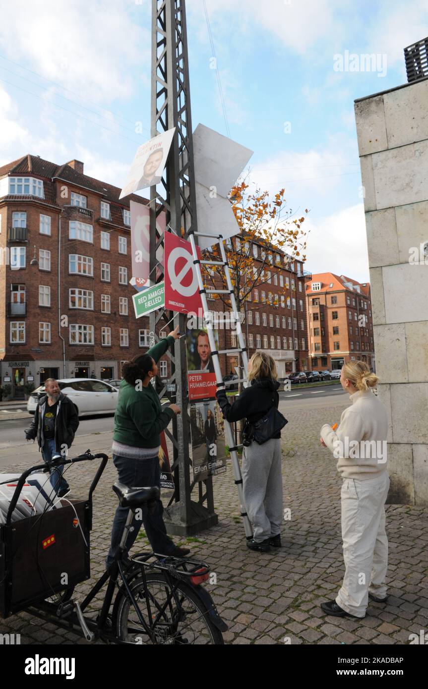 Copenhagen/Denmark/02 November 2022/ Now danish general electuons is over and young  female remove elections campaign playcards in capital.  (Photo. Francis Joseph Dean/Dean Pictures. Stock Photo