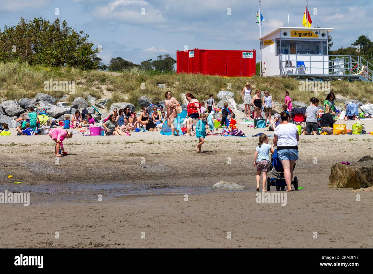 Lifeguard station watching families enjoying holiday on the beach Stock Photo