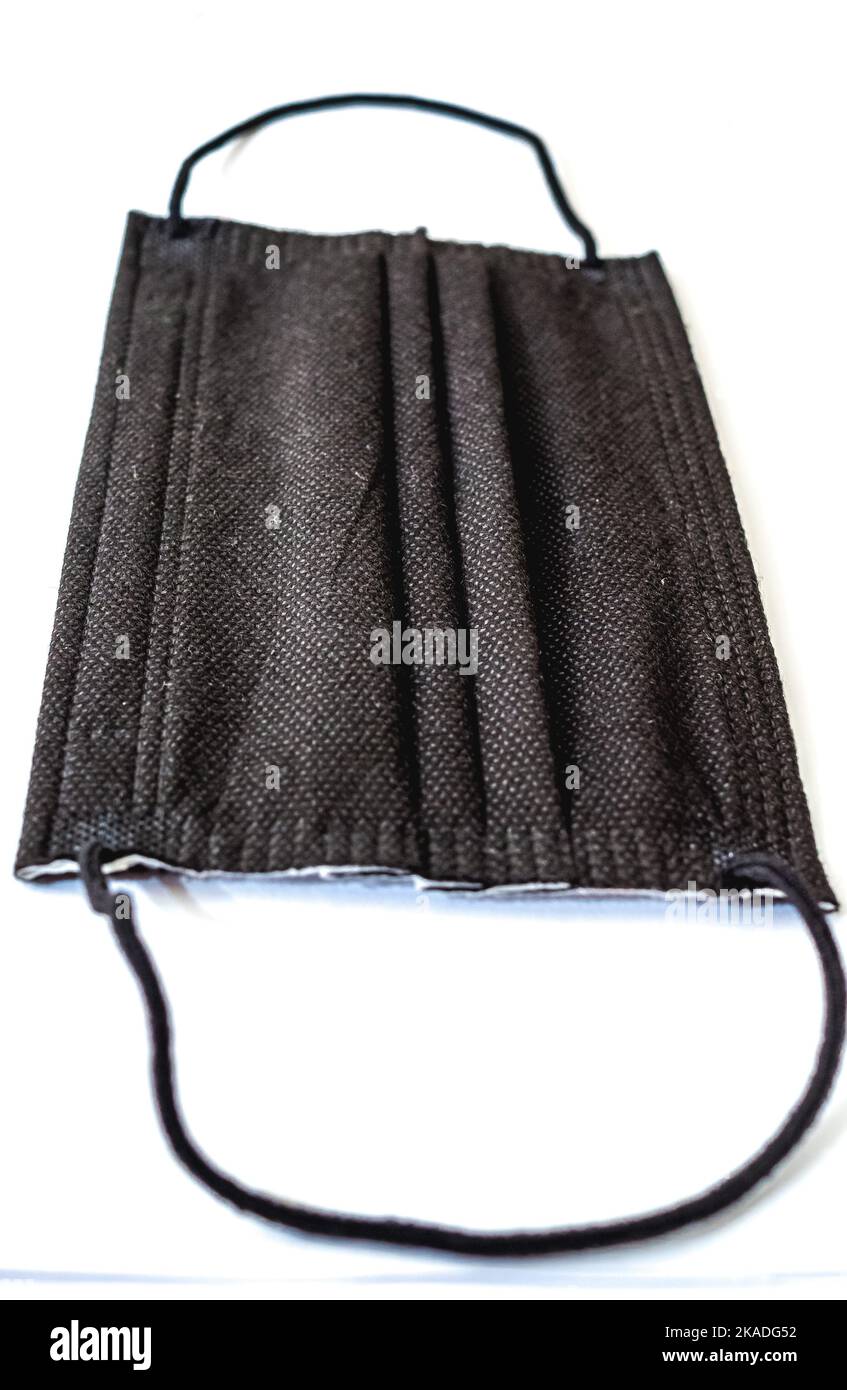 A black protective face mask isolated on white background Stock Photo ...
