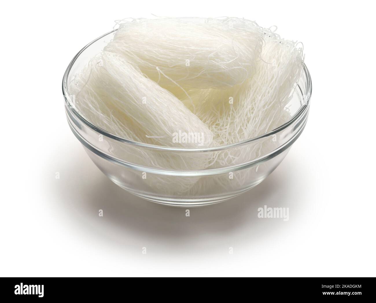 Dried cellophane noodles in a bowl. Cellophane noodles are known as long rice in Hawaii. Stock Photo