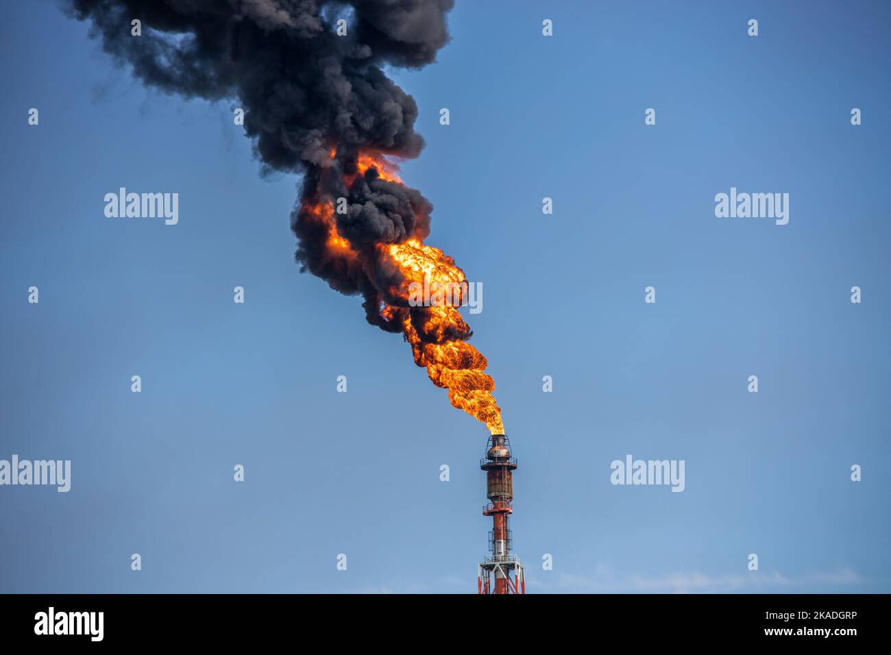 A power tower burning in the daytime Stock Photo Alamy