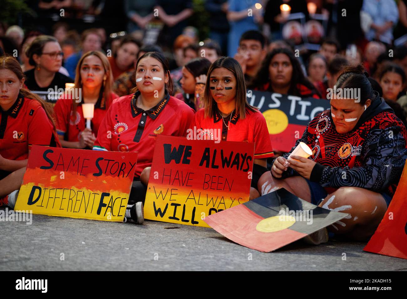 School students take part in a candlelight vigil in Brisbane on 2