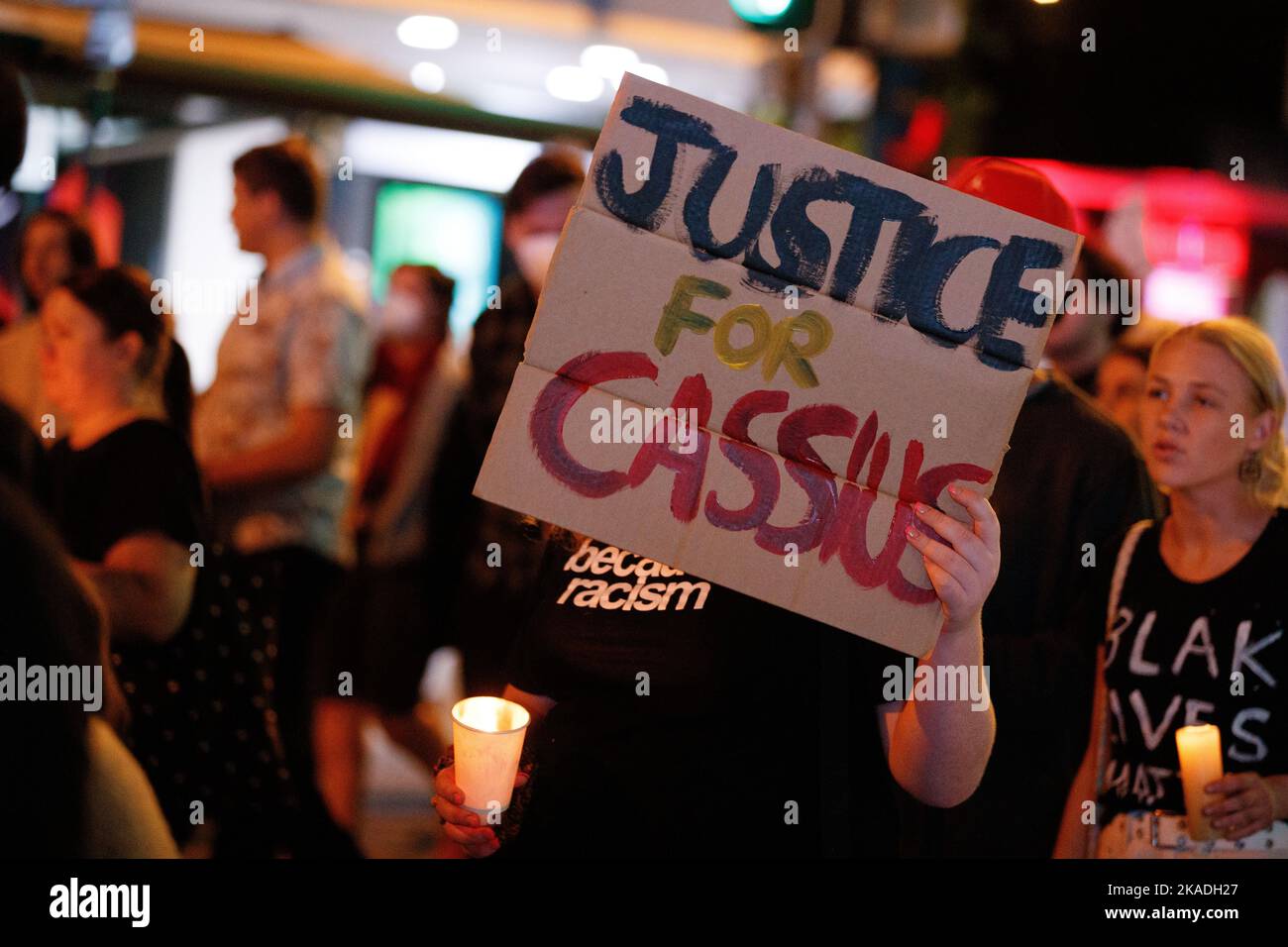 Protesters carry candles and flags during a vigil in Brisbane on 2 November 2022 for Cassisus Turvey, who was allegedly murdered in a racist attack in Perth in October. Demonstrators gathered in Brisbane for a candlelight vigil for Indigenous teenager Cassius Turvey, who was assaulted during a racist attack as he walked home from school in Perth, Western Australia last month. 15 year-old Turvey died of his wounds ten days later on the 23rd of October. Protesters in many towns and cities around the country simultaneously called for action on racially motivated violence and poor police practice. Stock Photo