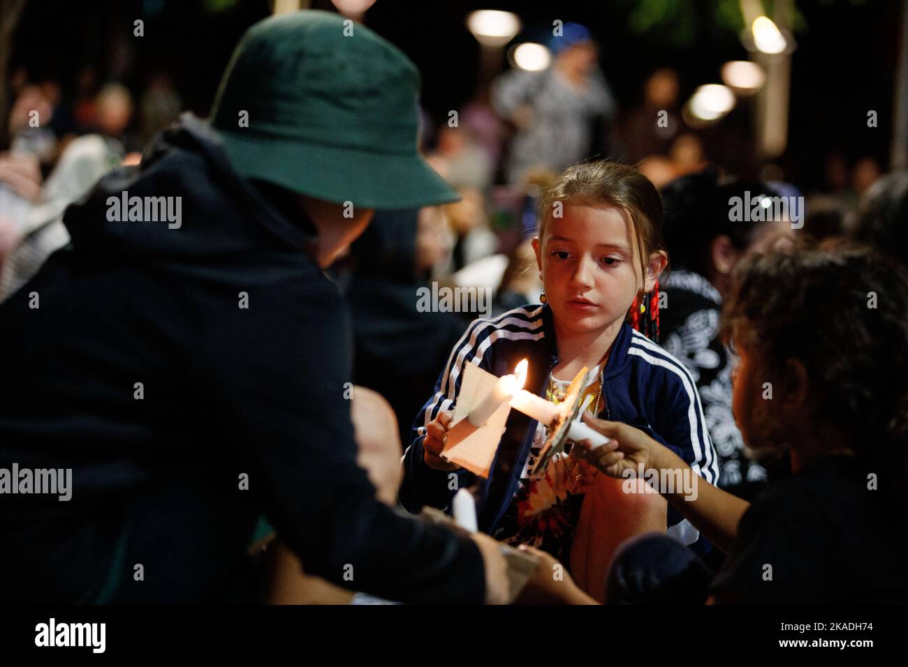 Children light candles during a vigil in Brisbane on 2 November 2022 for Cassisus Turvey, who was allegedly murdered in a racist attack in Perth in October. Demonstrators gathered in Brisbane for a candlelight vigil for Indigenous teenager Cassius Turvey, who was assaulted during a racist attack as he walked home from school in Perth, Western Australia last month. 15 year-old Turvey died of his wounds ten days later on the 23rd of October. Protesters in many towns and cities around the country simultaneously called for action on racially motivated violence and poor police practice. (Photo by J Stock Photo