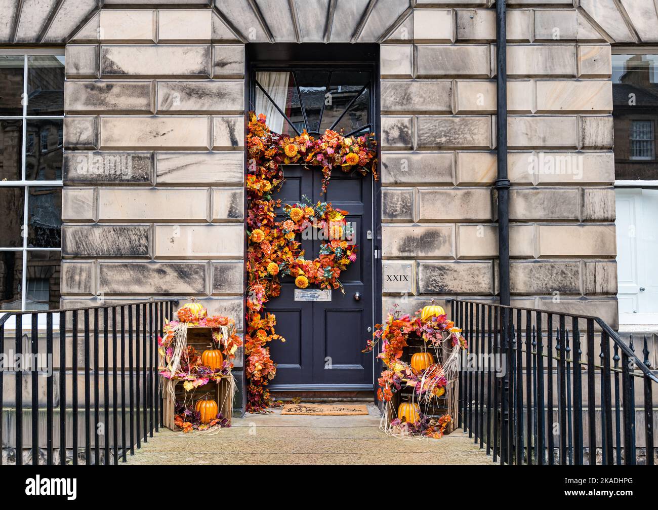 Georgian front door with Halloween celebration pumpkin and harvest wreath decoration, Edinburgh New Town, Scotland, UK Stock Photo