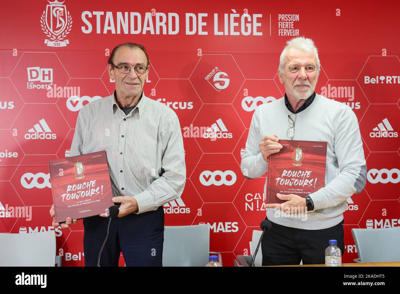 Former player Christian Piot and Former player Eric Gerets pose for the