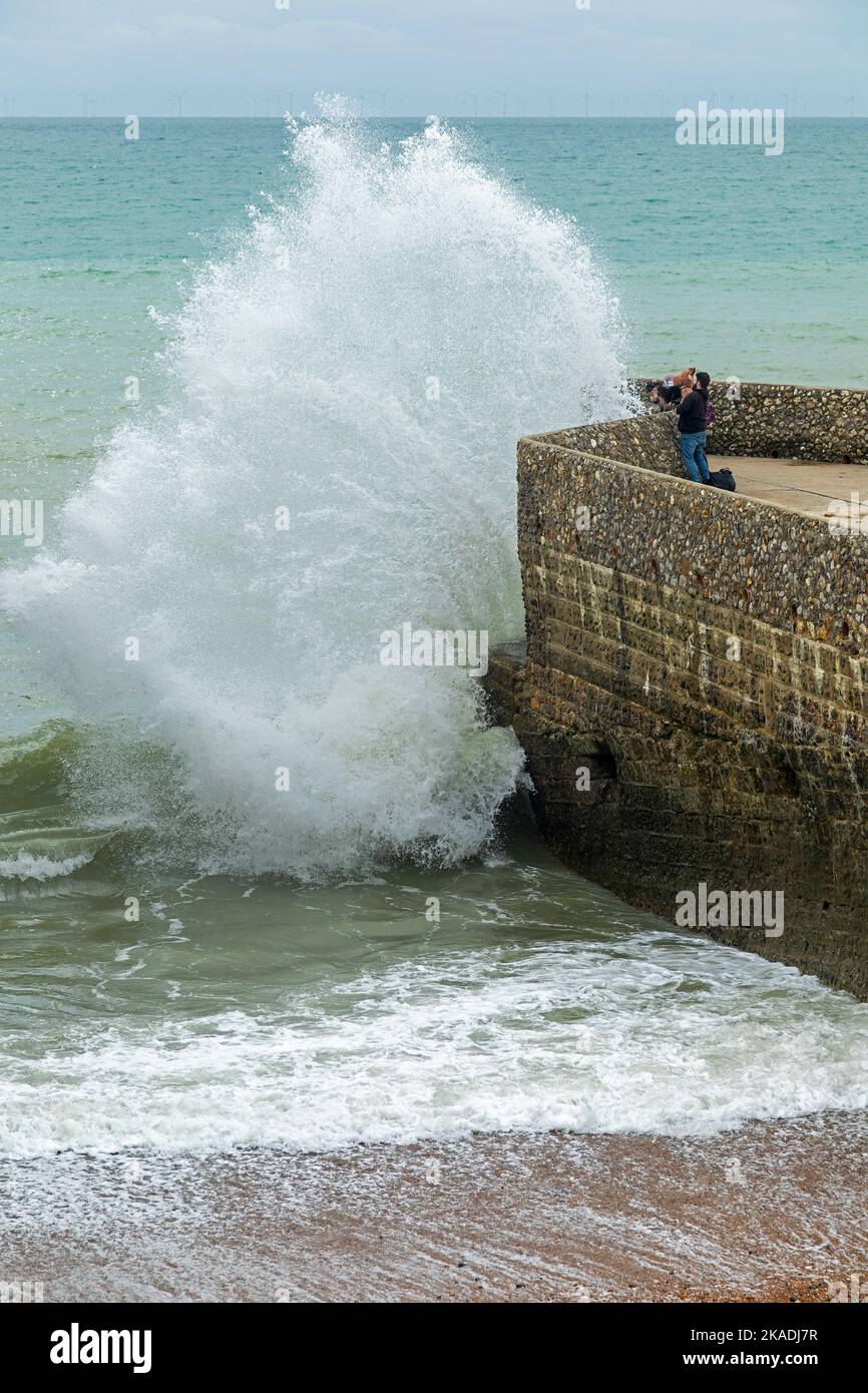 Waves crashing over groyne, seafront, Brighton, England, Great Britain Stock Photo