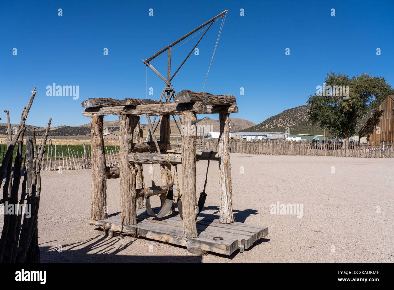 A sling frame or ox-shoeing stock used to support an ox for shoeing in the outdoor pioneer museum display at Cove Fort, Utah.  Unlike horses, oxen can Stock Photo