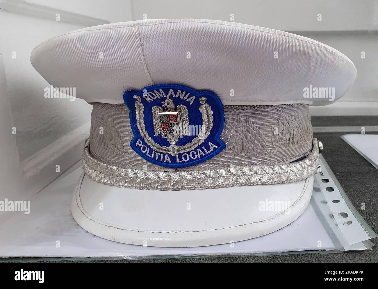 a close-up with a local police cap from Romania, white, traffic Stock Photo