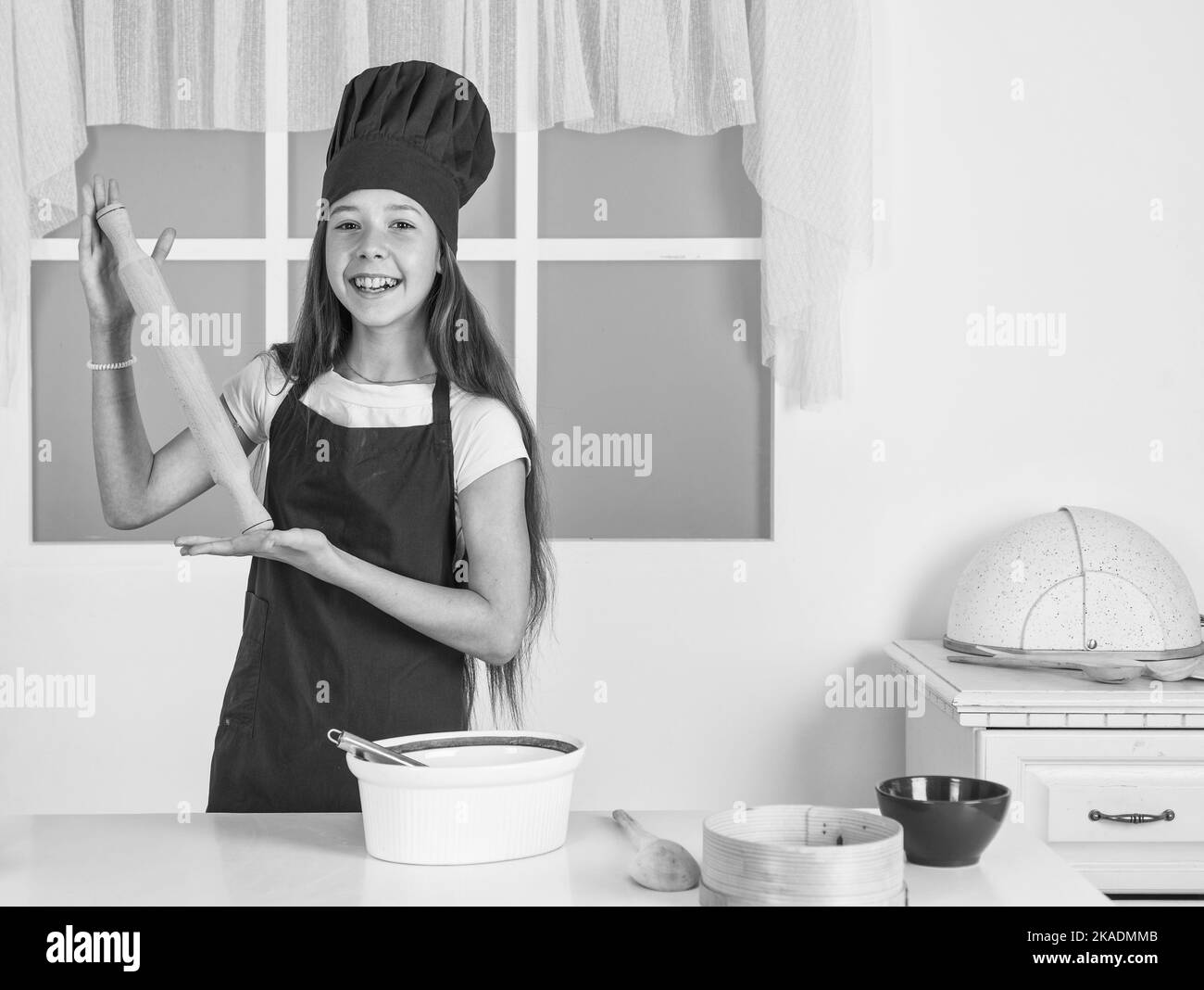 Being hungry. child study how to cook by recipe. kid cooking in kitchen. choosing future career Stock Photo