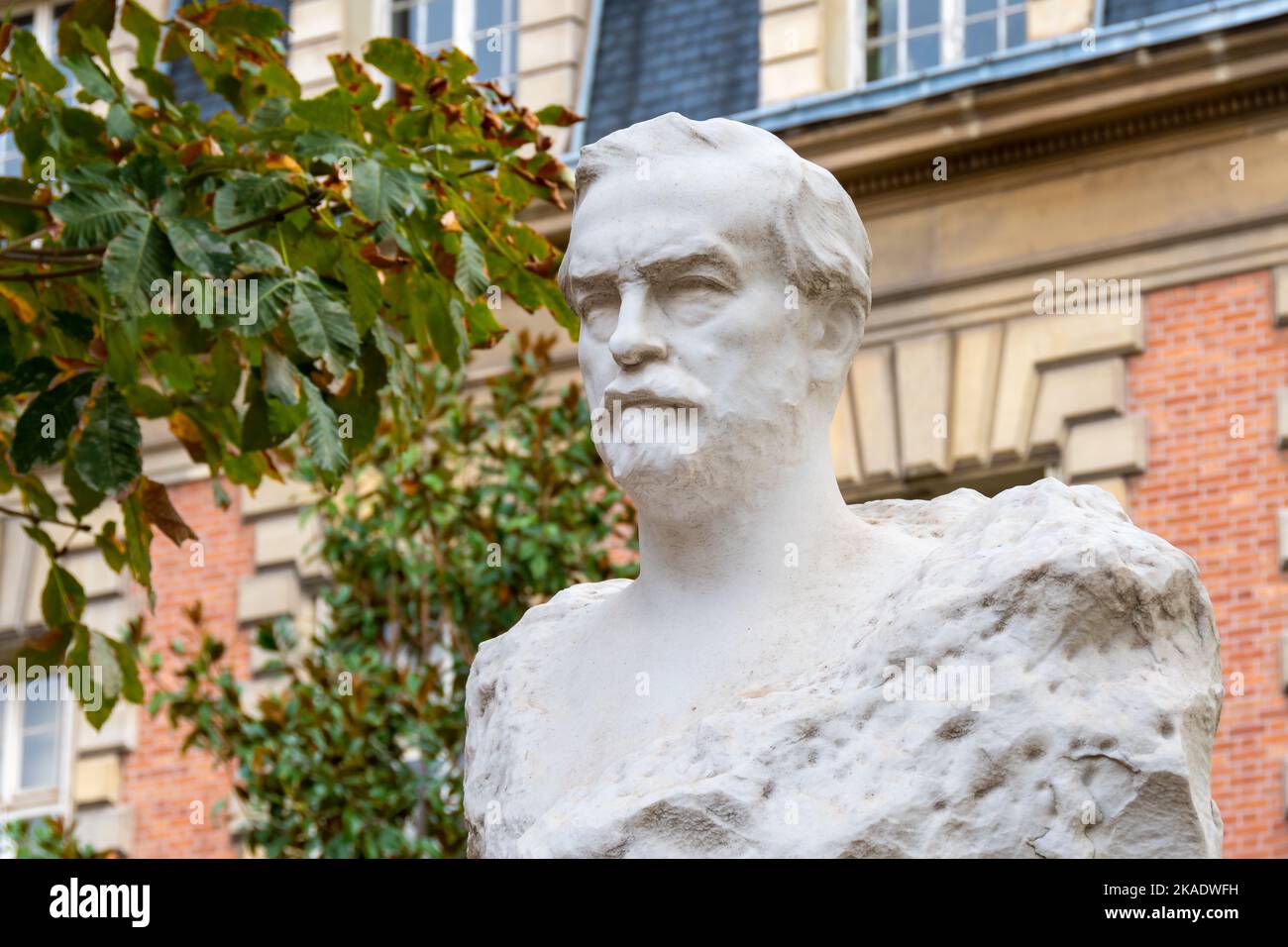 Statue of Louis Pasteur in front of the Institut Pasteur building. Louis Pasteur is a French scientist who discovered the vaccine against rabies Stock Photo