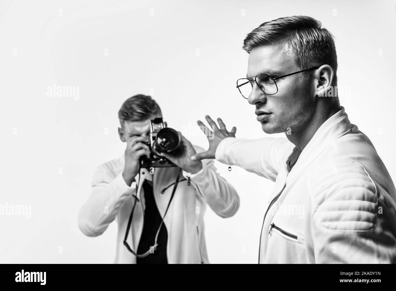 twin brothers men photographer look alike use vintage photo camera