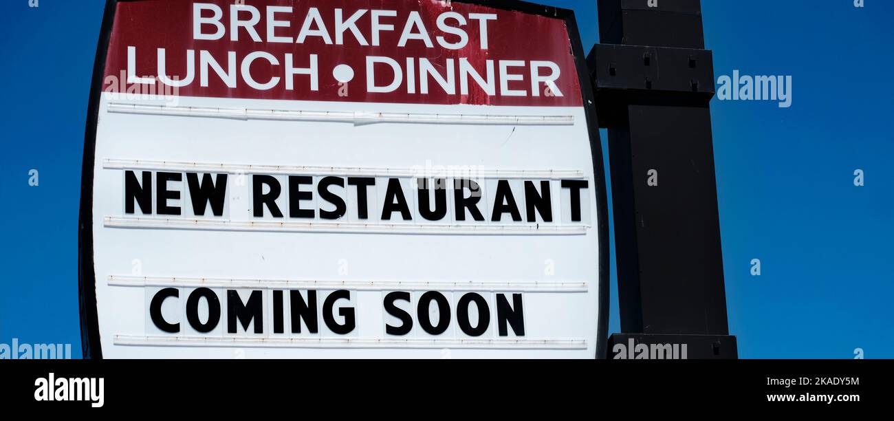 Sign for a new restaurant coming soon for breakfast lunch and dinner