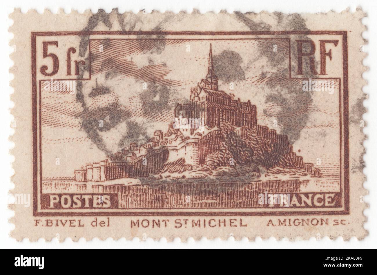 FRANCE - 1931: An 5 francs brown postage stamp depicting Mont-Saint-Michel, is a tidal island and mainland commune in Normandy, France. The commune's position—on an island just a few hundred metres from land—made it accessible at low tide to the many pilgrims to its abbey, but defensible as an incoming tide stranded, drove off, or drowned would-be assailants. The island remained unconquered during the Hundred Years' War; a small garrison fended off a full attack by the English in 1433. Louis XI recognised the reverse benefits of its natural defence and turned it into a prison Stock Photo