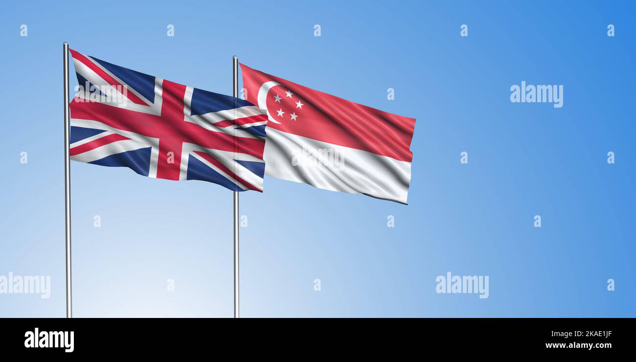 United Kingdom flag and Singapore flag, with blue sky Stock Photo