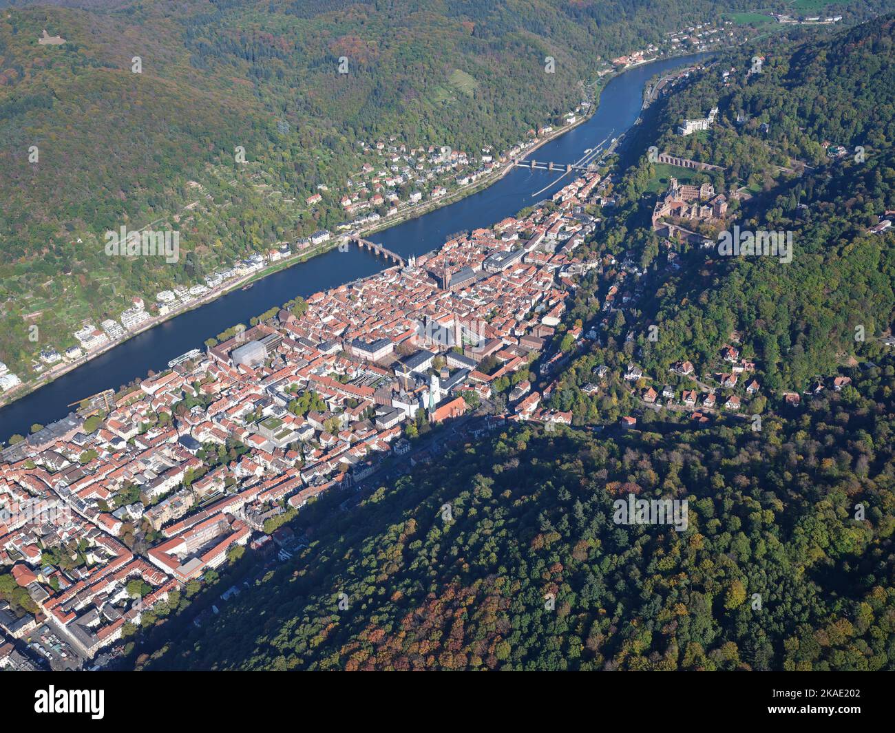 AERIAL VIEW. The old town of Heidelberg on the left bank of the Neckar River with its medieval castle on the hillside. Baden-Württemberg, Germany. Stock Photo