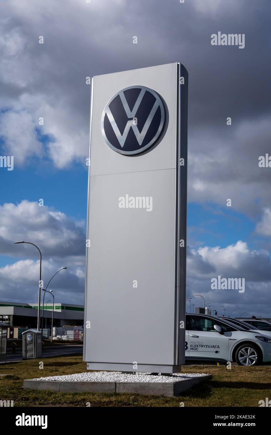 Wroclaw, Poland - February 19, 2022: Closeup of a column with an emblem of Volkswagen Group company. No people, cloudy sky. Stock Photo
