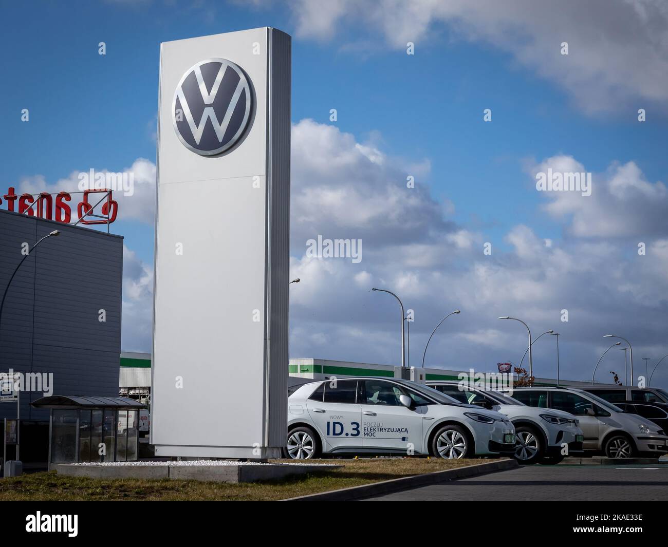 Wroclaw, Poland - February 19, 2022: Closeup of a column with an emblem of Volkswagen Group company. No people, cloudy sky. Stock Photo