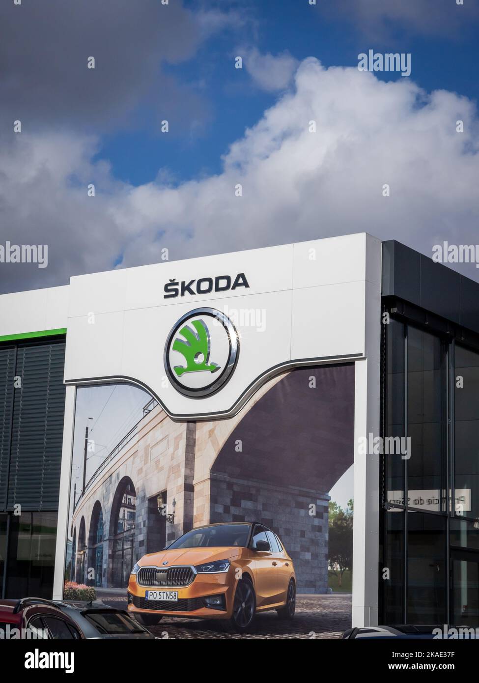 Wroclaw, Poland - February 19, 2022: Company store building with an emblem of Skoda Auto, Czech automobile manufacturer. No people, cloudy sky. Stock Photo
