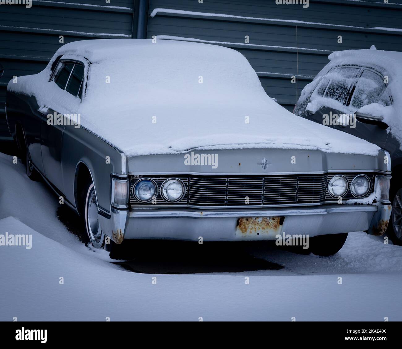 Reykjavik, Iceland - January 24, 2022: Old, abandoned classic Lincoln Continental car, covered with snow. Stock Photo