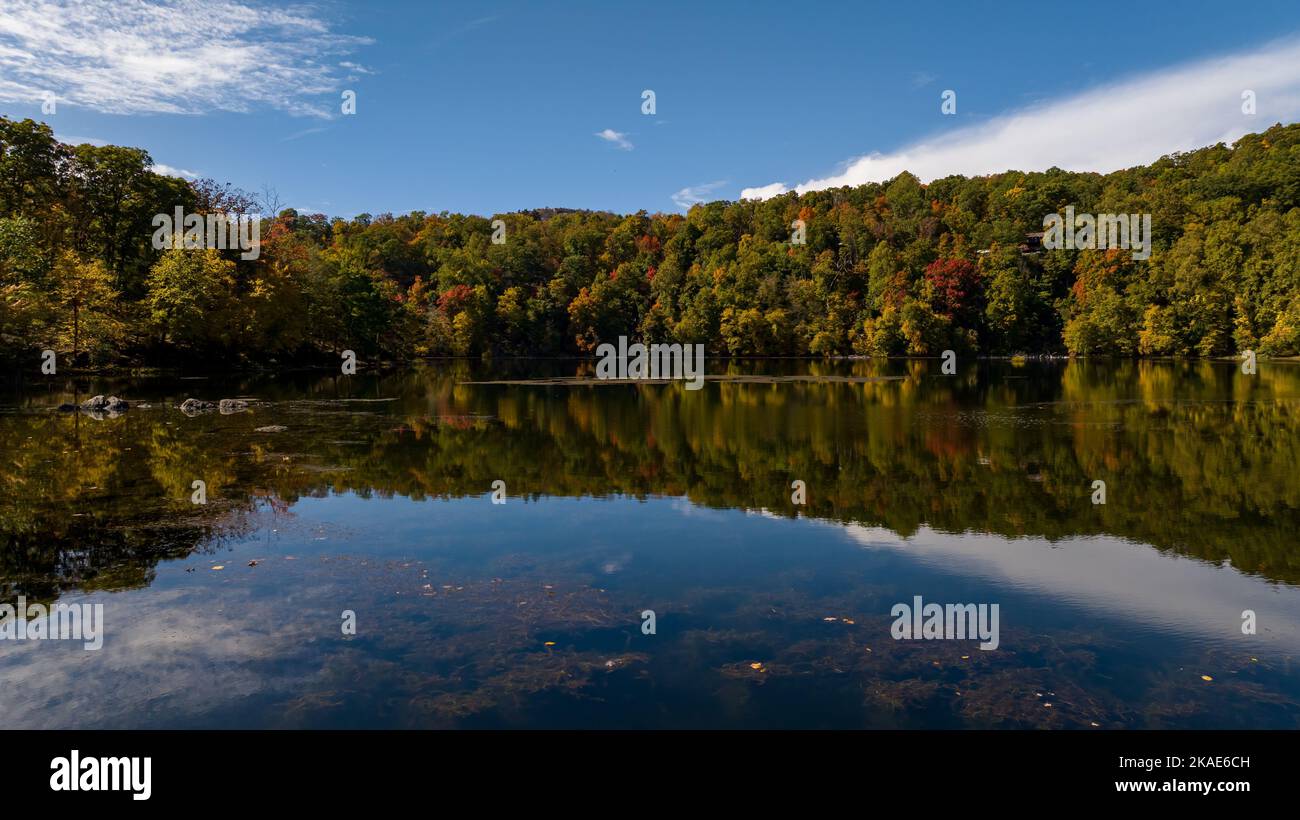 An aerial of a lake in upstate New York during the colorful fall