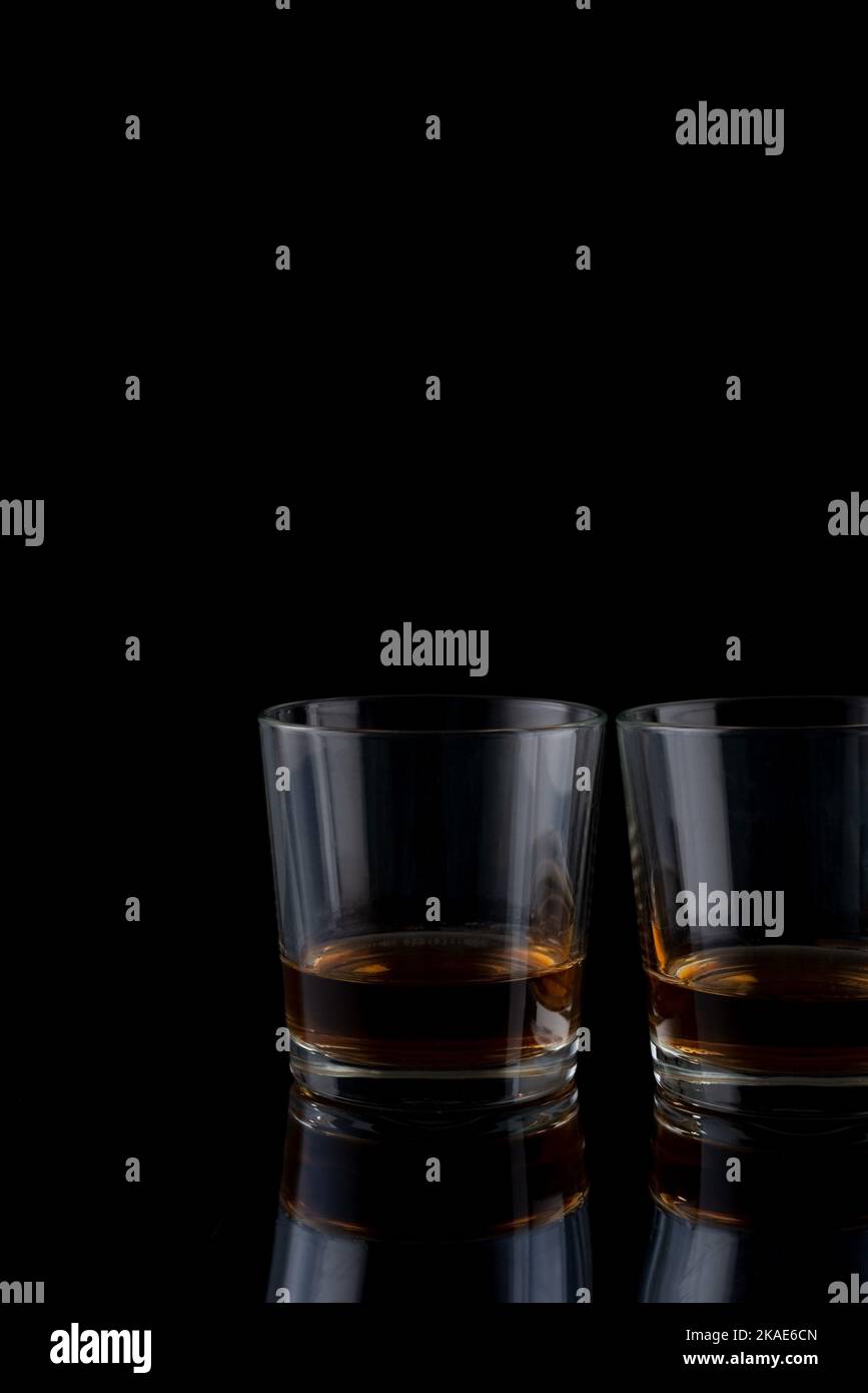 glasses with whiskey on a black background Stock Photo