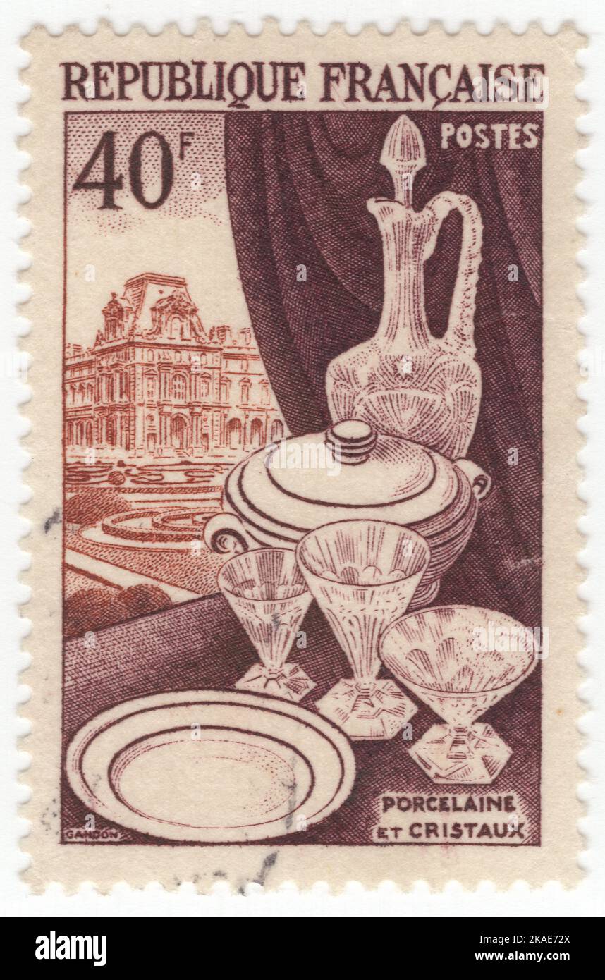 FRANCE - 1954 May 6: An 40 francs dark brown, violet-brown and orange-brown postage stamp depicting Porcelain and glassware Stock Photo