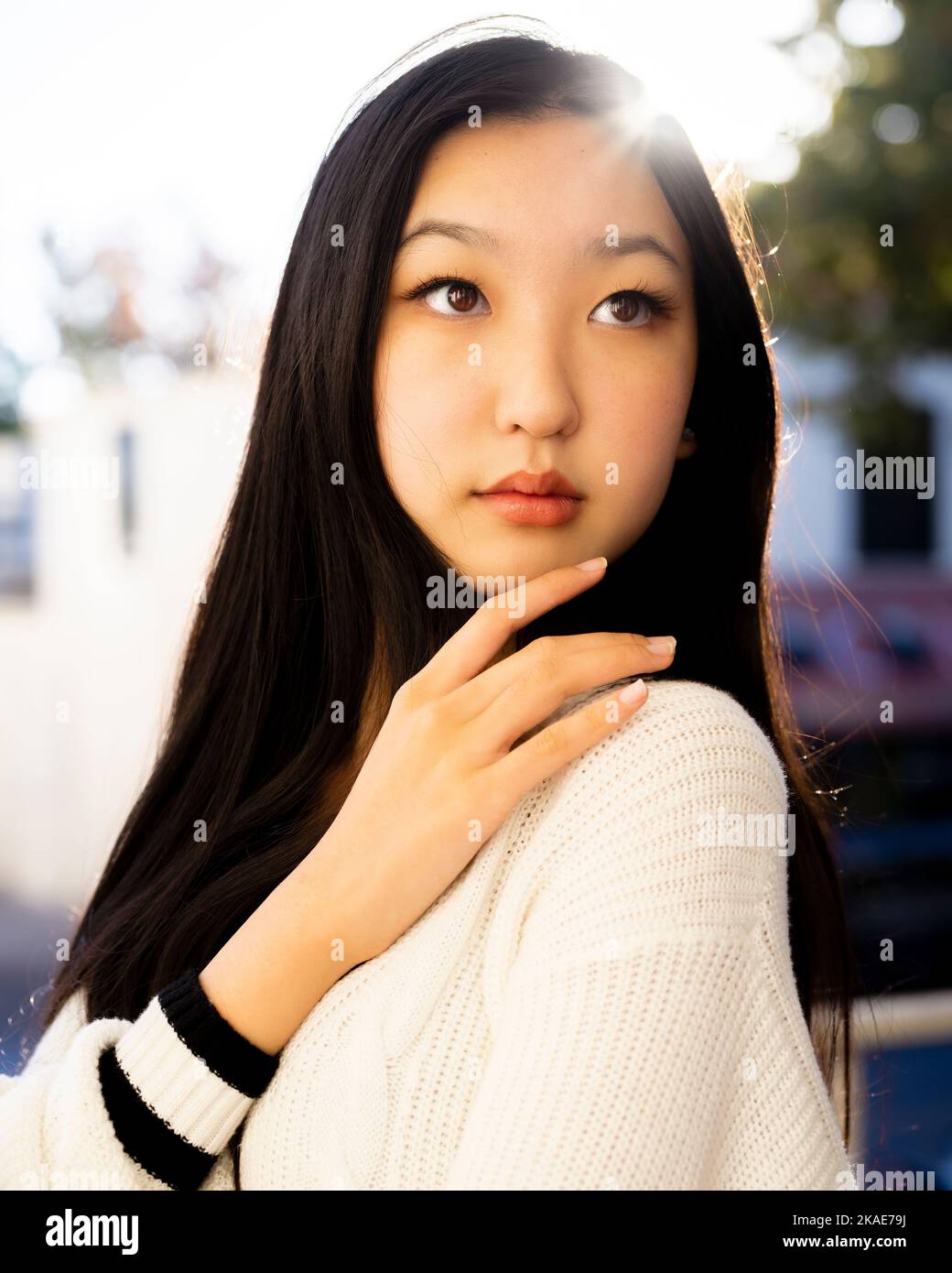 Backlit Golden Hour Portrait of  Multiracial Teenage Female in Downtown Palo Alto | Warm Tones Stock Photo