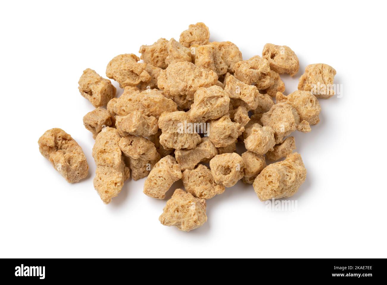 Heap of dried soya chunks close up isolated on white background Stock Photo