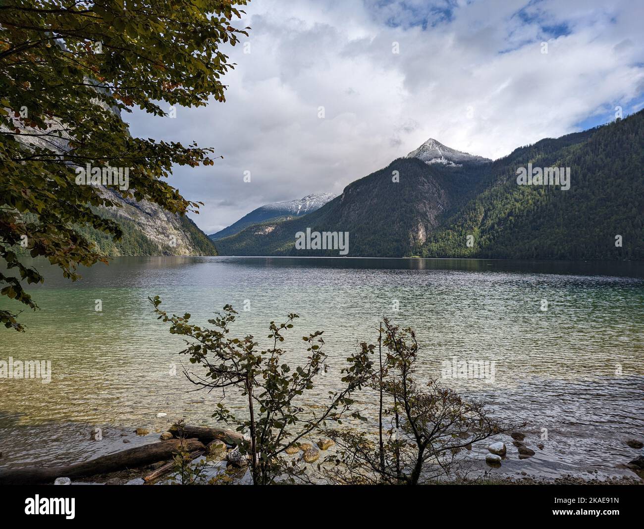 The lake Koenigsee with the mountain Jenner covered in snow in Germany ...