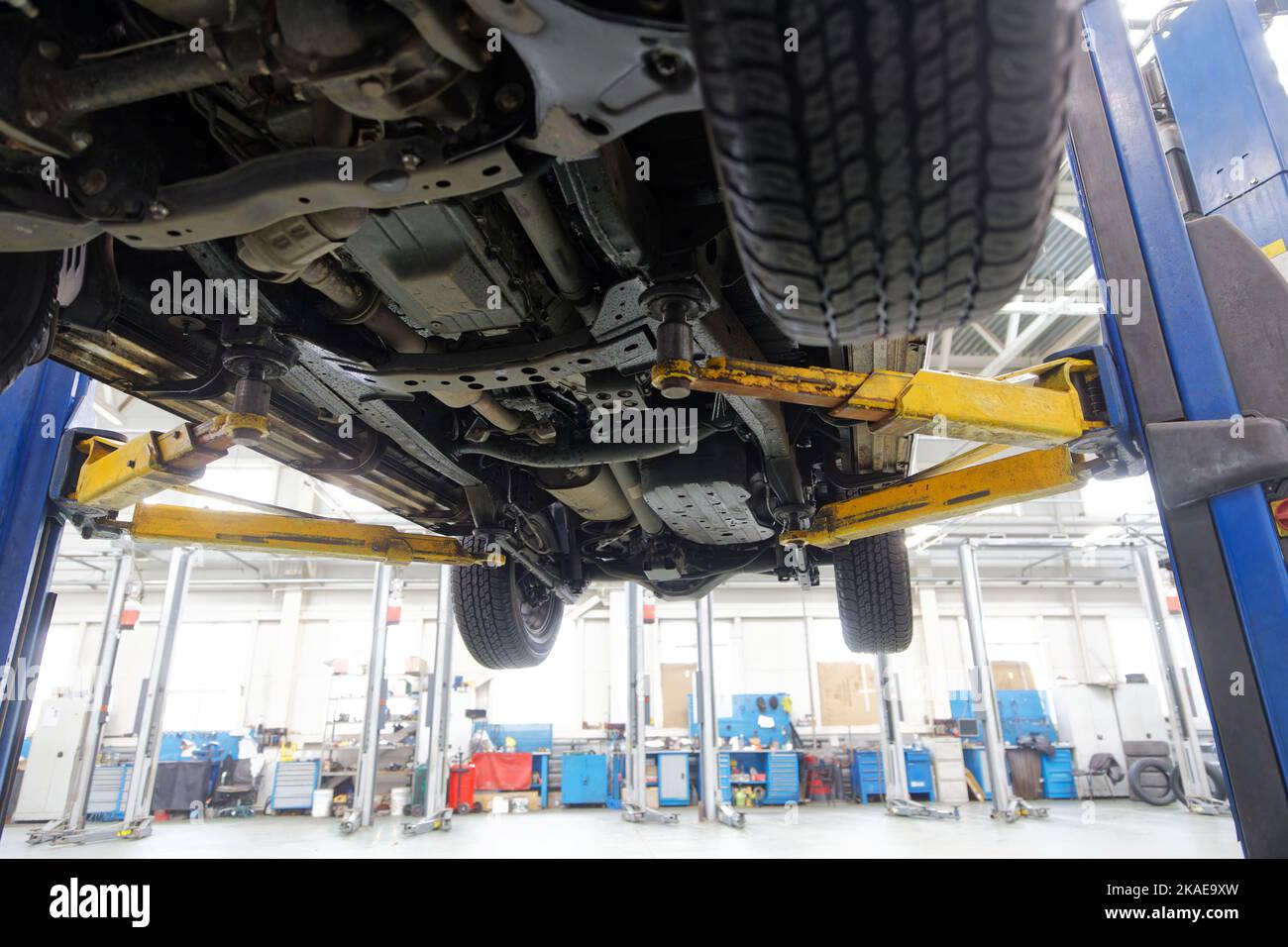 Car on lift in center hi-res stock photography and images - Alamy