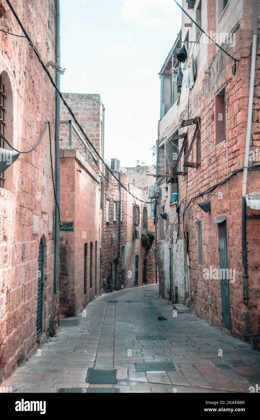 A narrow street with brick buildings during daytime Stock Photo - Alamy