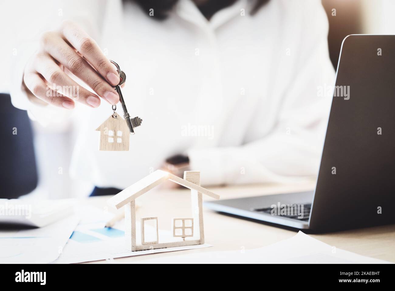 Real estate agents agree to buy a home and give keys to clients at