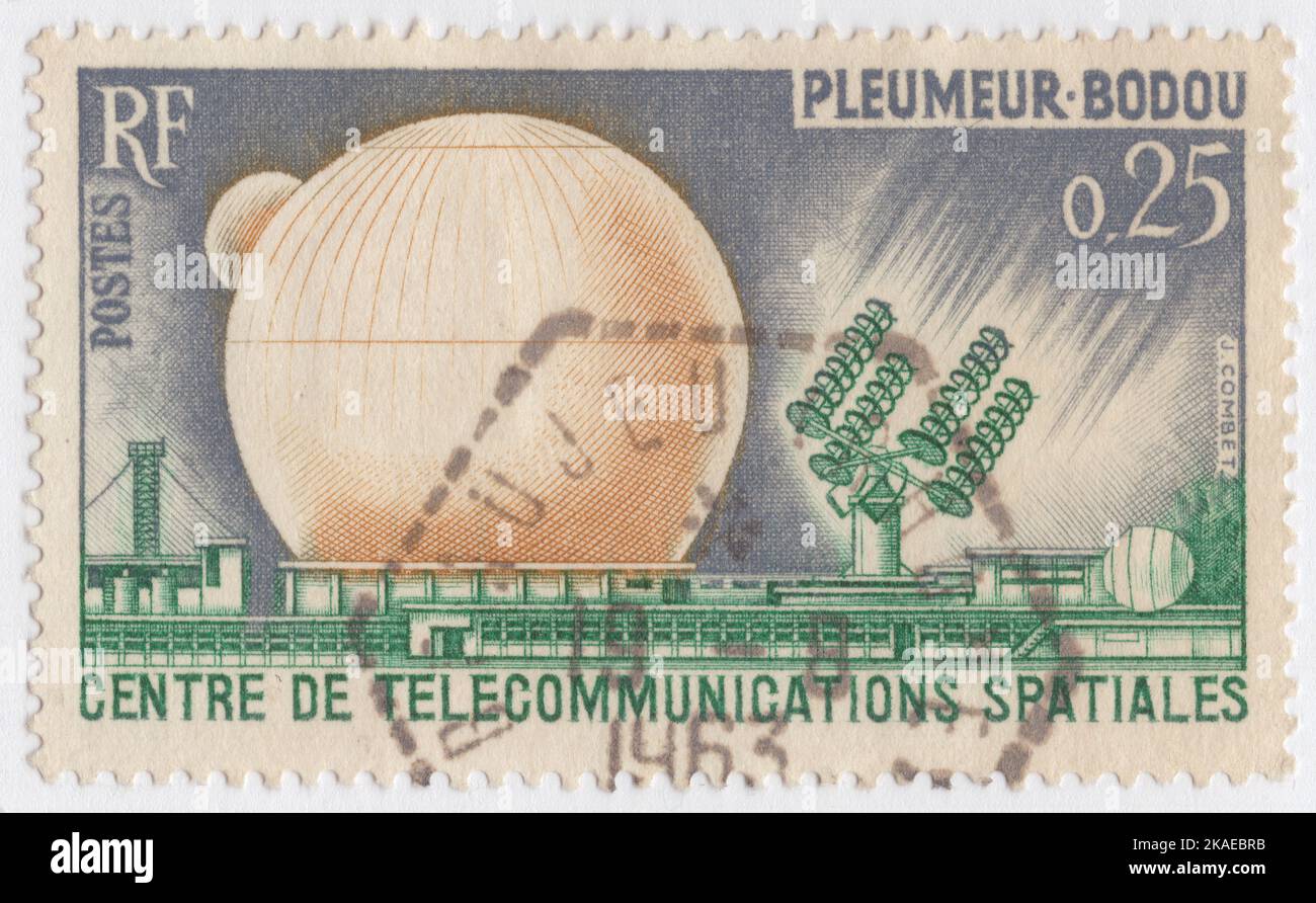 FRANCE - 1962 September 29: An 25 centimes gray, yellow and green postage stamp depicting Space Communications Center, Pleumeur-Bodou. 1st TV connection of the US and Europe through Telstar satellite. Telstar 1 launched on top of a Thor-Delta rocket on July 10, 1962. It successfully relayed through space the first television pictures, telephone calls, and telegraph images, and provided the first live transatlantic television feed Stock Photo