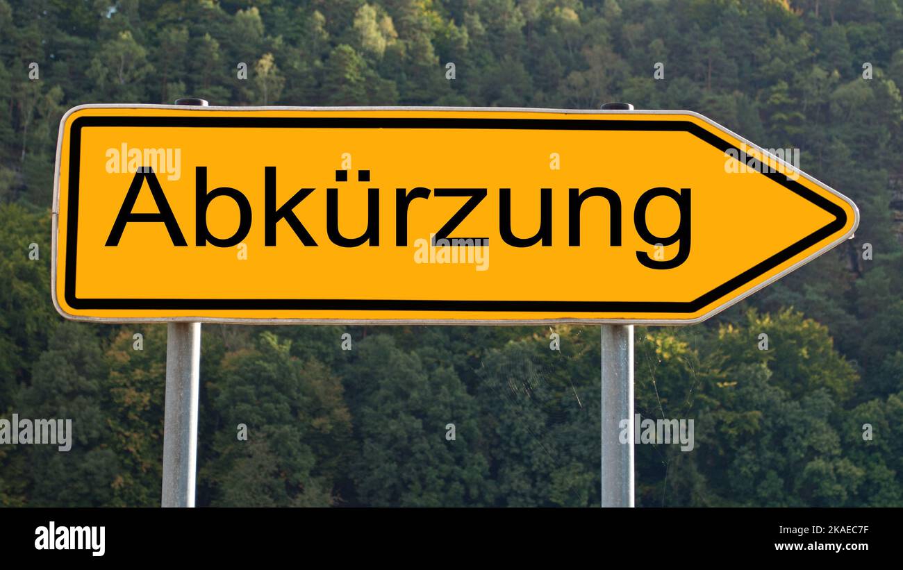 Signpost with the inscription 'Abkürzung', translation 'Abbreviation' Stock Photo