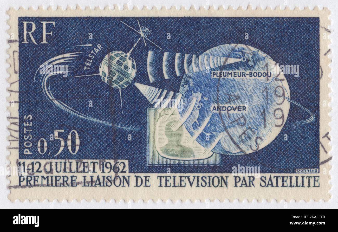 FRANCE - 1962 September 29: An 50 centimes dark blue, green and ultramarine postage stamp depicting Telstar, Earth and Television Set. 1st TV connection of the USA and Europe through Telstar satellite. Telstar 1 launched on top of a Thor-Delta rocket on July 10, 1962. It successfully relayed through space the first television pictures, telephone calls, and telegraph images, and provided the first live transatlantic television feed Stock Photo