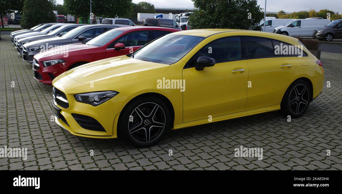 Wietmarschen, Germany Oct 25 2022 A row of used Mercedes-Benz cars at a car seller. The front one in yellow is a Mercedes-Benz CLA 200 Shooting Brake Stock Photo