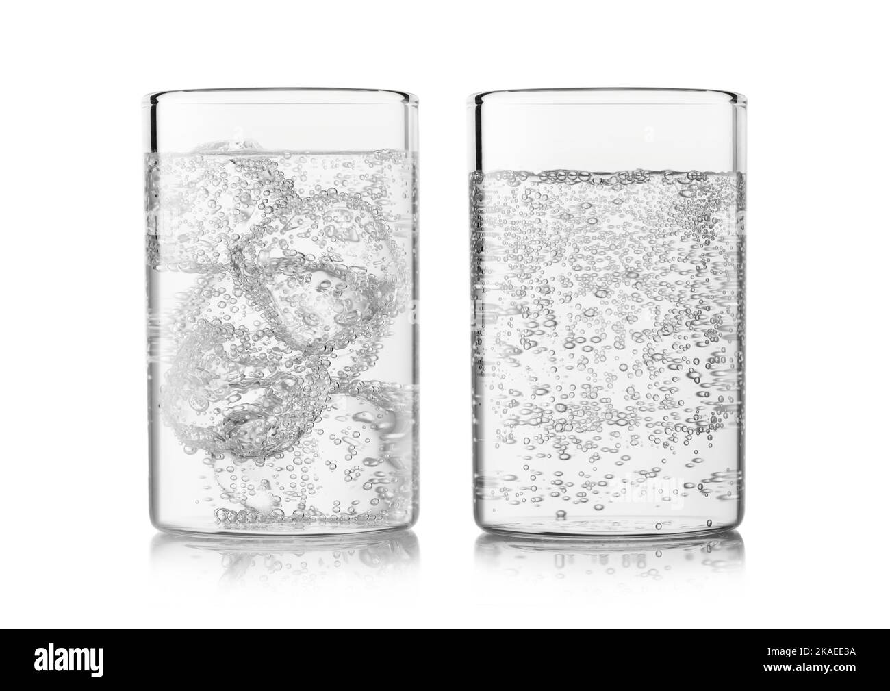 Mineral sparkling water with ice cubes and bubbles on white Stock Photo ...