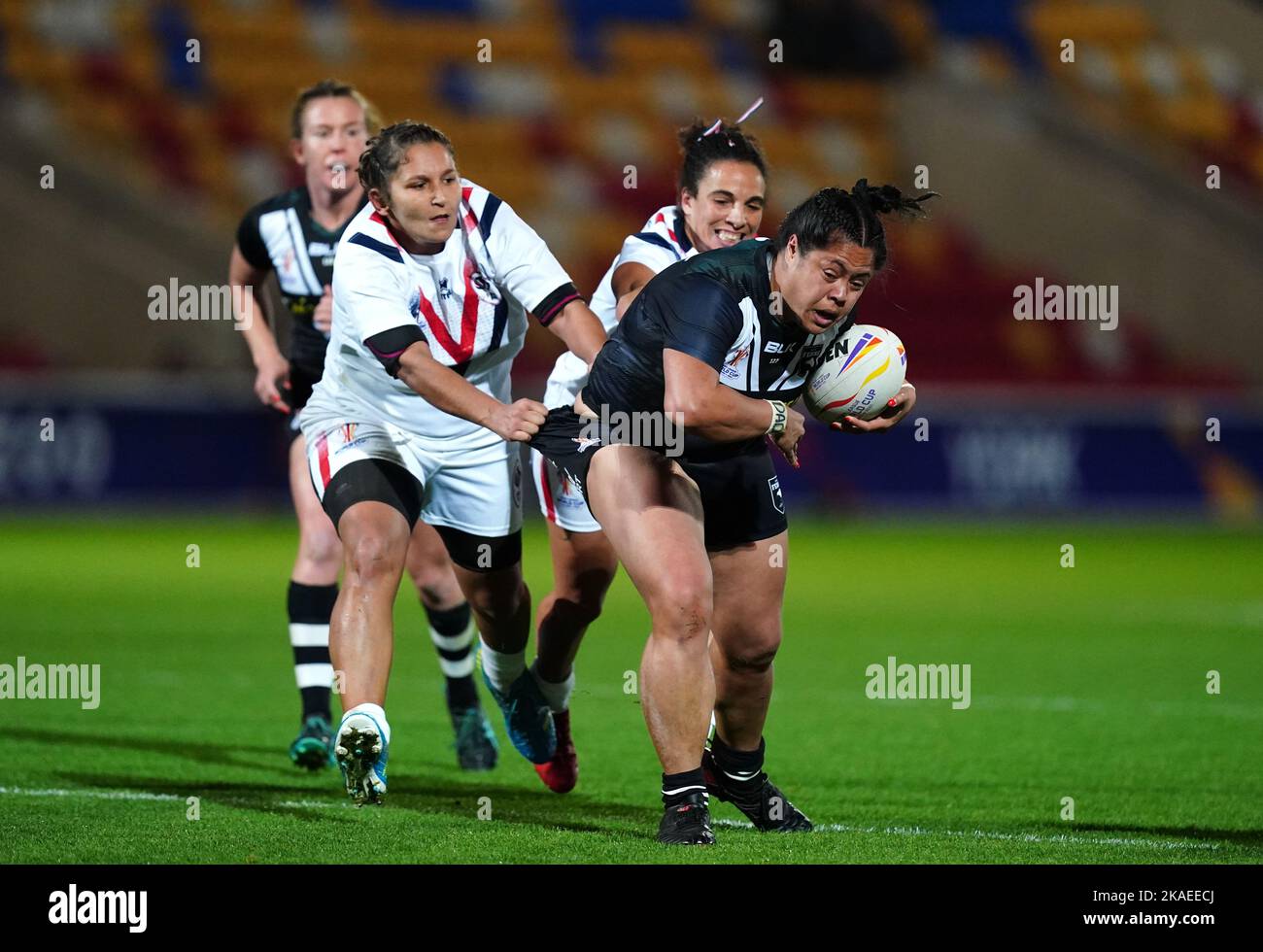 New Zealand's Annetta Nu'Uausala is tackled by France's Elisa Ciria and Leila Bessahli during the Women's Rugby League World Cup group B match at the LNER Community Stadium, York. Picture date: Wednesday November 2, 2022. Stock Photo