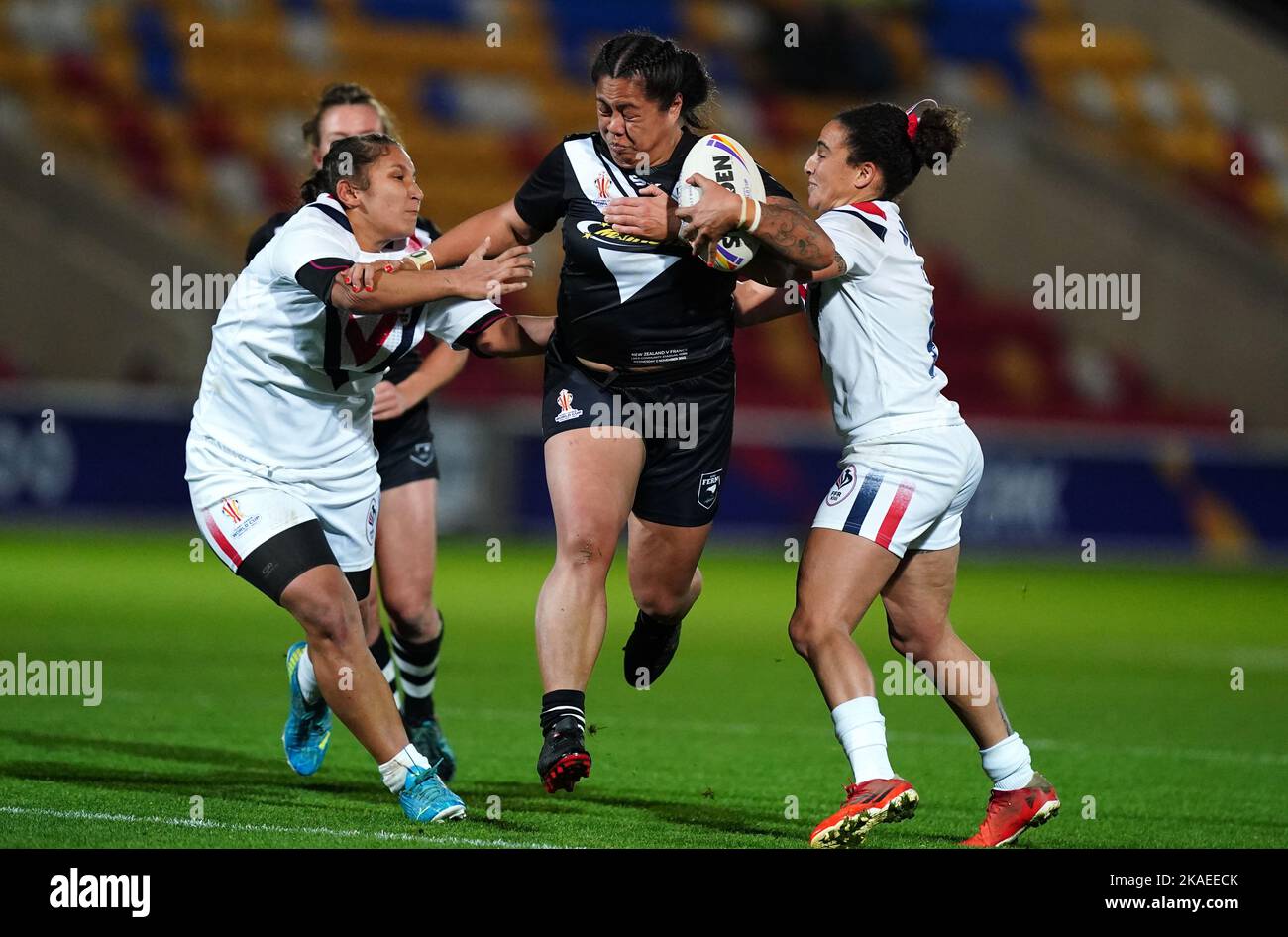 New Zealand's Annetta Nu'Uausala is tackled by France's Elisa Ciria and Leila Bessahli during the Women's Rugby League World Cup group B match at the LNER Community Stadium, York. Picture date: Wednesday November 2, 2022. Stock Photo