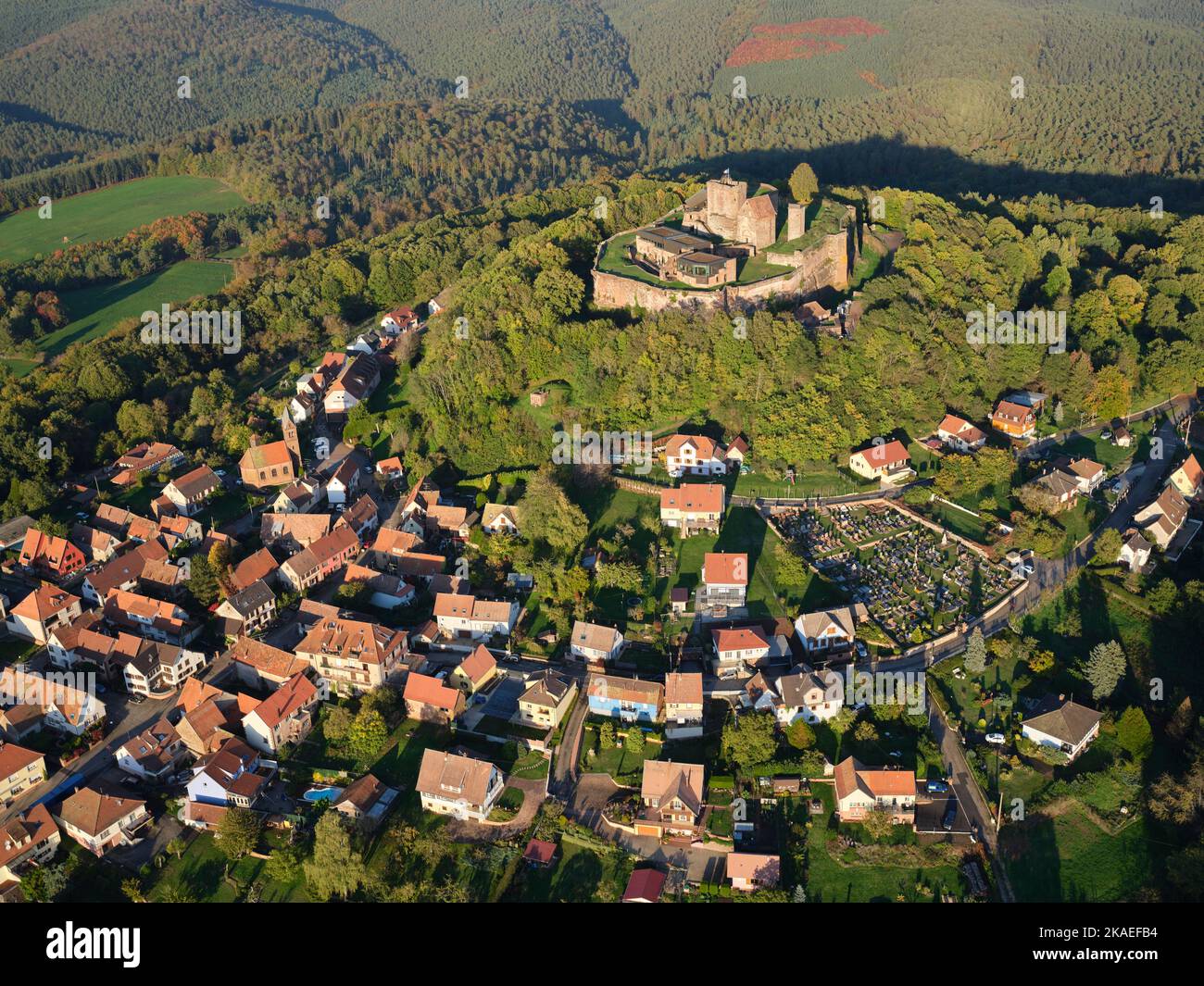 AERIAL VIEW. Medieval castle of Lichtenberg overlooking the namesake village. Bas-Rhin, Alsace, Grand Est, France. Stock Photo